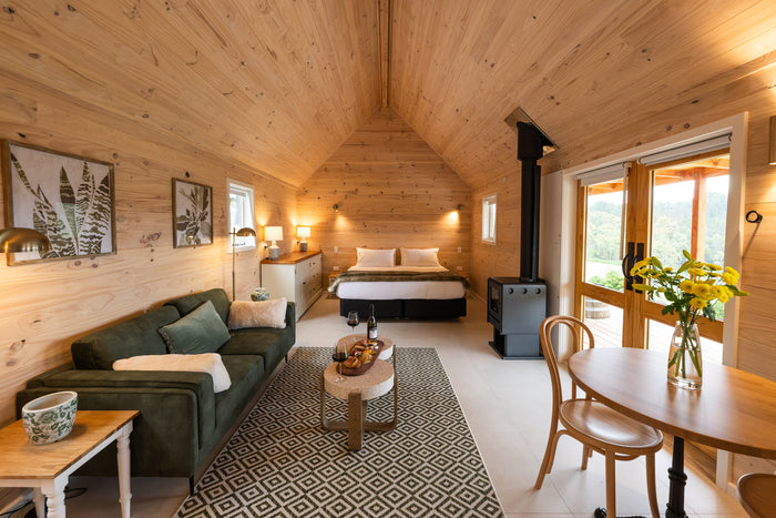 Timber interior of a Paroa Bay off-grid cabin